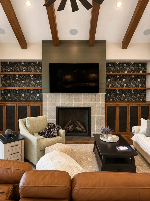 Dark floral wallpaper accent walls flanking a fireplace in a living room, Portland