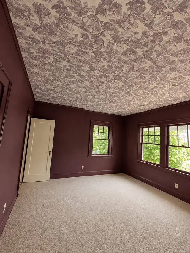 Toile wallpaper on the ceiling of a burgundy room, Portland