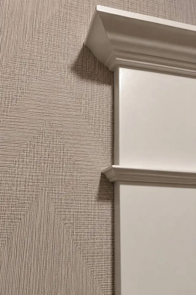 Precise wallpaper seam meeting crown molding and panel trim, Portland