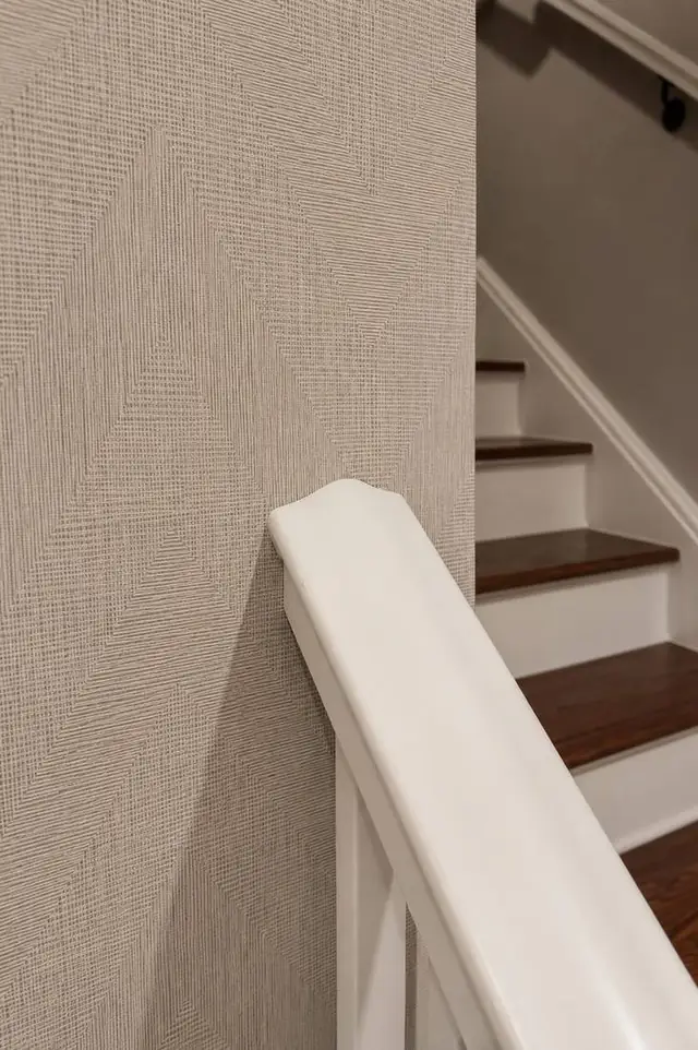 Wallpaper wrapped neatly around a stair handrail termination, Portland