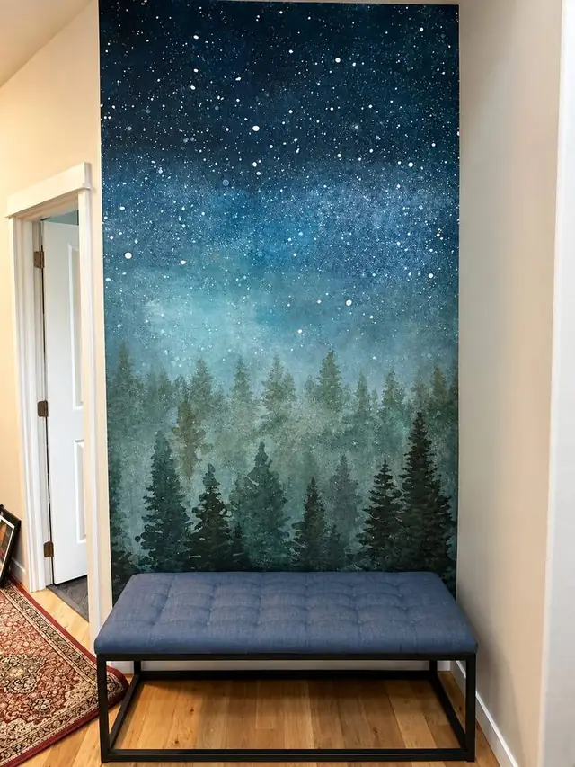 Starry night sky over misty pine forest mural in a hallway, Vancouver
